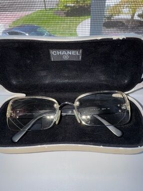 CHANEL Rimless Women's Eyeglasses in Clear and Black